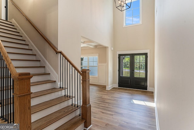 101 Bonnie Lynn Ln, Carrollton, GA 30117 - entryway with a healthy amount of sunlight, wood finished floors, an inviting chandelier, and stairs