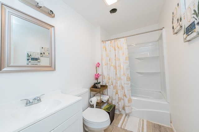 full bathroom featuring shower / bath combination with curtain, toilet, vanity, and tile flooring