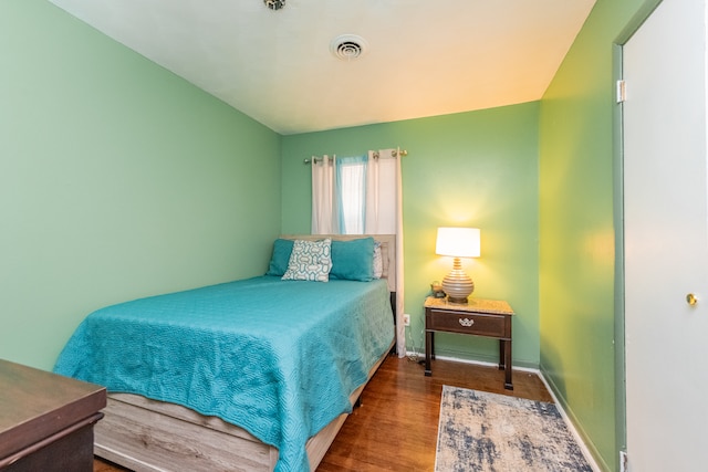 bedroom featuring dark hardwood / wood-style floors