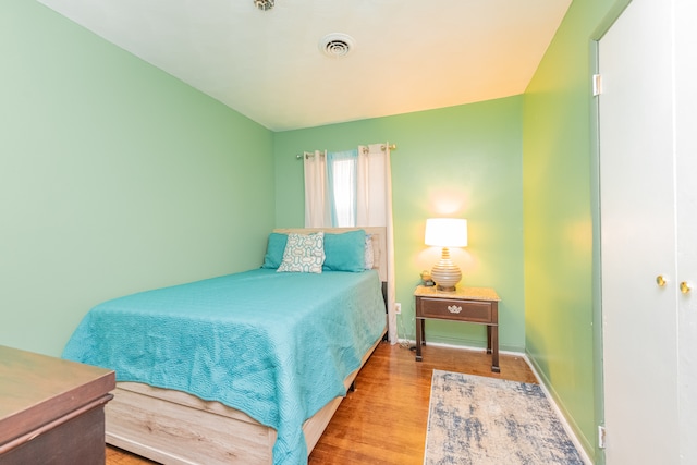 bedroom with light wood-type flooring