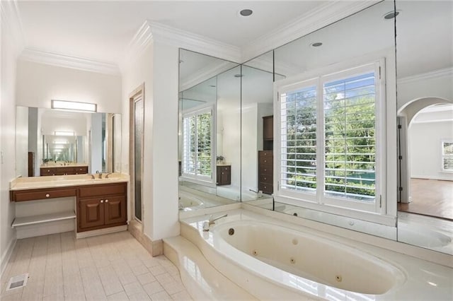 bathroom featuring tile floors, ornamental molding, independent shower and bath, and vanity with extensive cabinet space