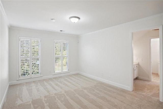 carpeted empty room with ornamental molding