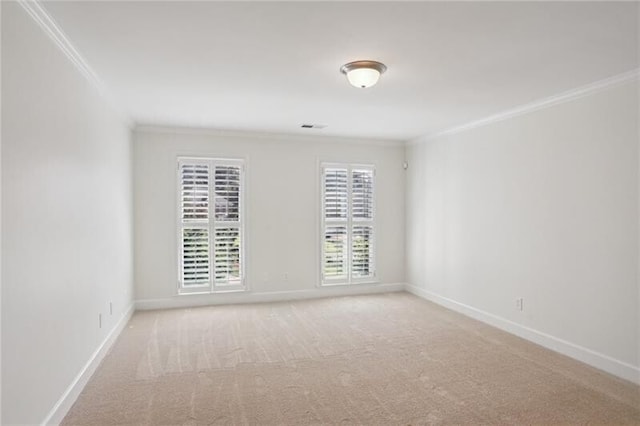 unfurnished room with light colored carpet and crown molding