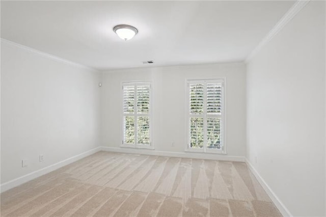 carpeted spare room featuring ornamental molding