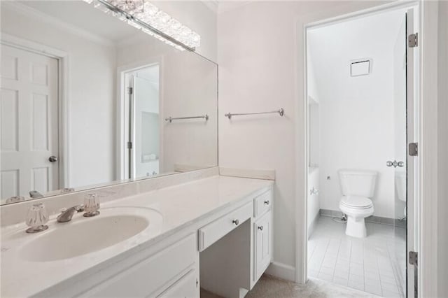 bathroom featuring toilet, tile floors, and vanity with extensive cabinet space