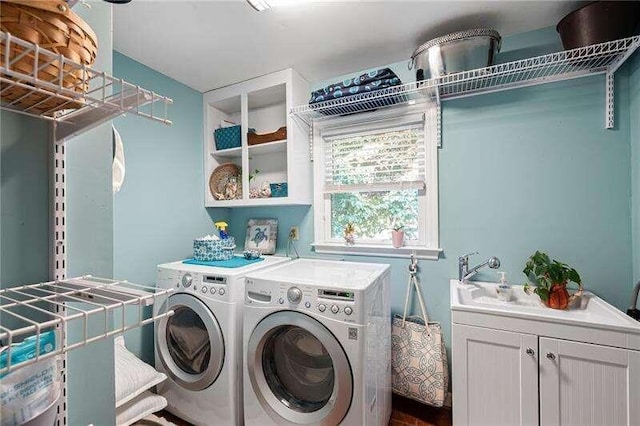 laundry area with cabinets and separate washer and dryer