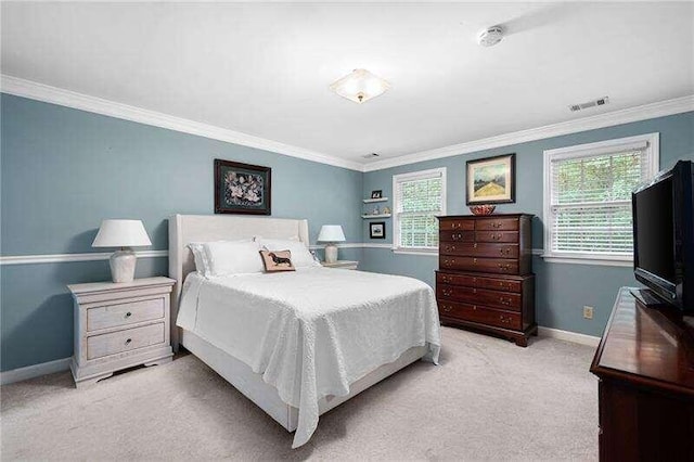 bedroom with light carpet and crown molding