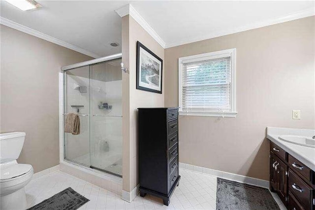 bathroom featuring walk in shower, crown molding, vanity, and toilet