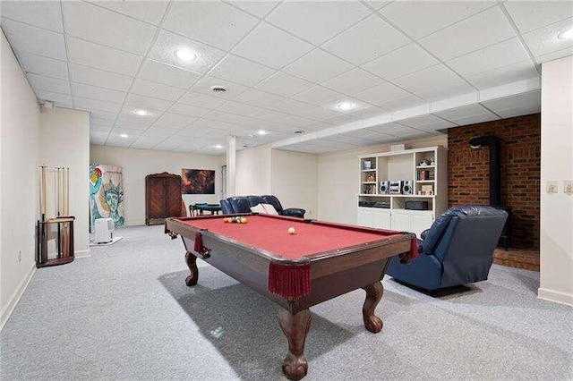 playroom featuring carpet floors, pool table, and a wood stove