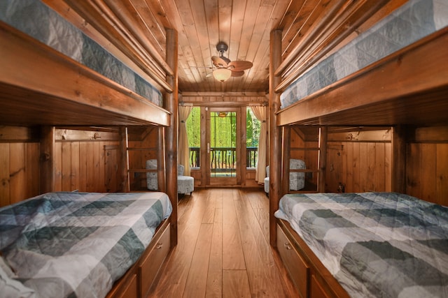 686 Lake Dr, Morganton, GA 30560 - bedroom featuring wood walls, access to outside, wooden ceiling, and light wood-type flooring