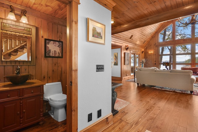 686 Lake Dr, Morganton, GA 30560 - interior space featuring hardwood / wood-style flooring, vanity, vaulted ceiling with beams, and toilet