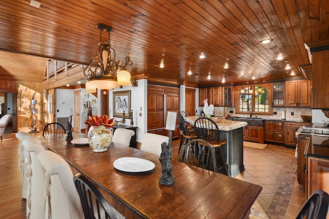 686 Lake Dr, Morganton, GA 30560 - tiled dining space featuring a chandelier, wood ceiling, and sink