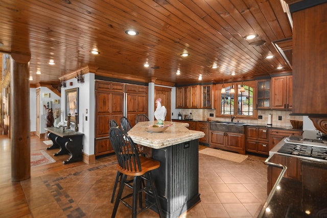 686 Lake Dr, Morganton, GA 30560 - kitchen with a kitchen breakfast bar, wood ceiling, stone countertops, and a center island