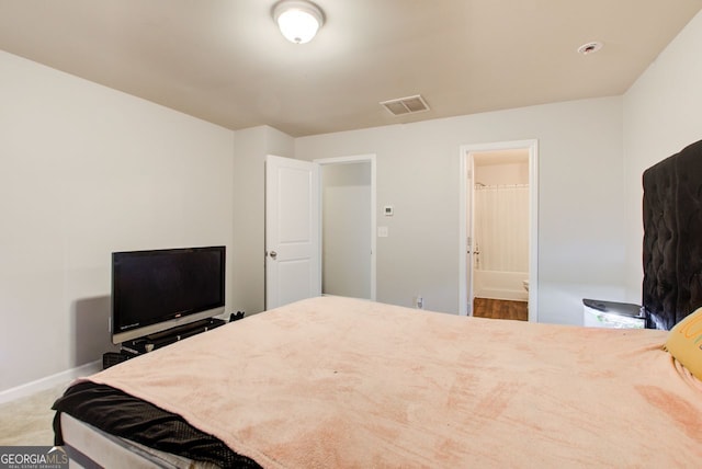 bedroom featuring ensuite bathroom