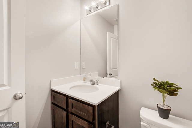 bathroom with vanity and toilet