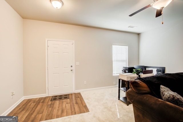 office space with ceiling fan and light wood-type flooring