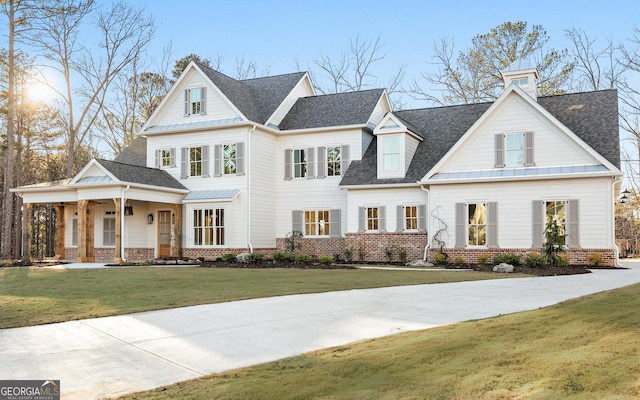 view of front of house with a front lawn and covered porch