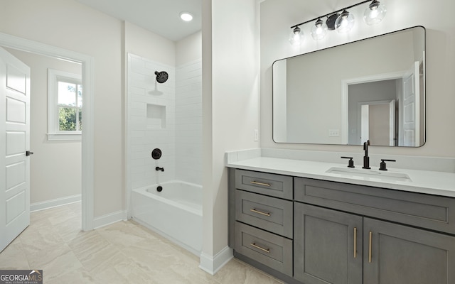 bathroom with vanity and tiled shower / bath combo