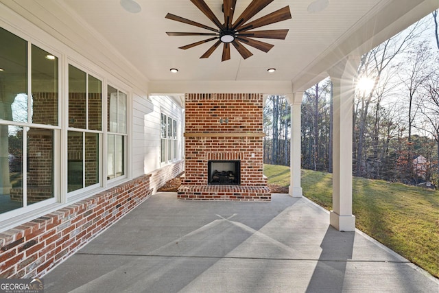 view of patio / terrace featuring an outdoor brick fireplace