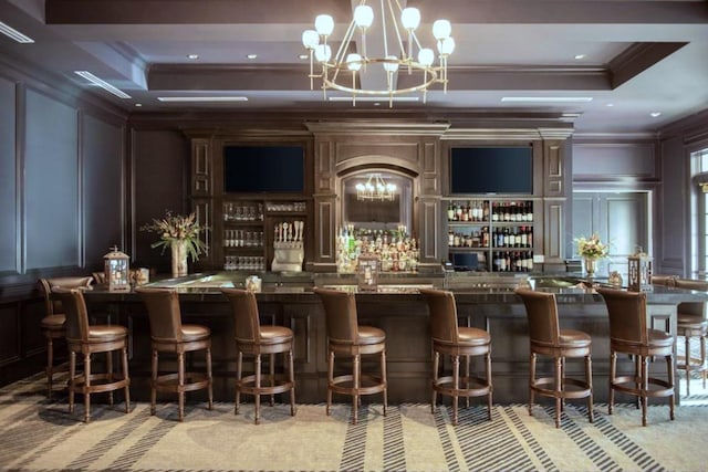 bar featuring ornamental molding and a notable chandelier