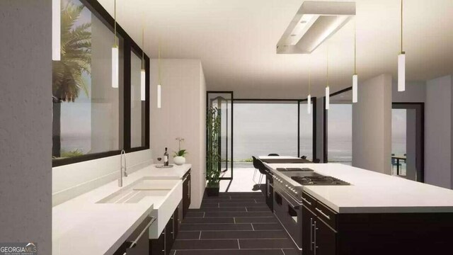 bathroom featuring a water view, tile flooring, and sink