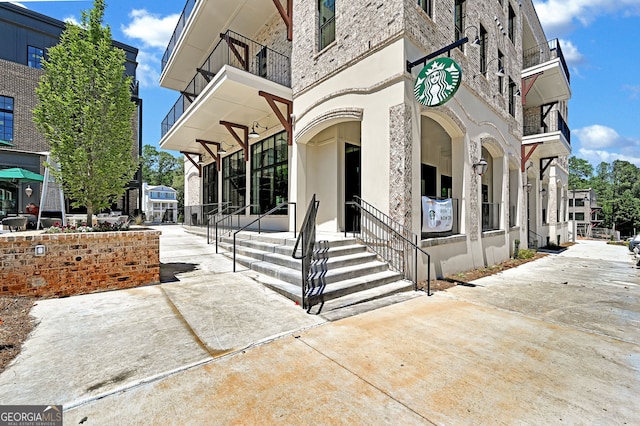 view of front of home with a balcony