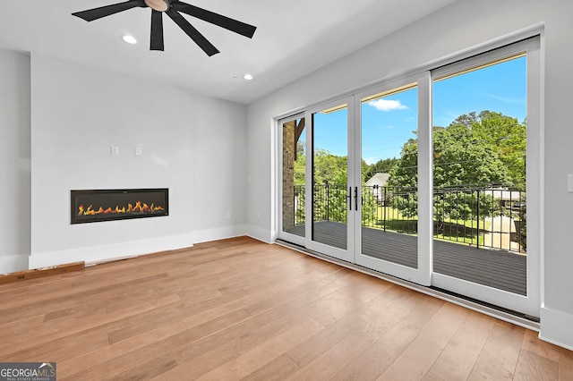 interior space with ceiling fan and light wood-type flooring