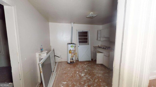 washroom featuring sink and gas water heater