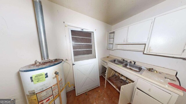 clothes washing area with water heater