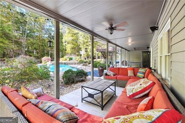 view of patio featuring an outdoor living space and ceiling fan