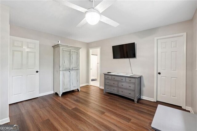 unfurnished bedroom with dark hardwood / wood-style floors and ceiling fan