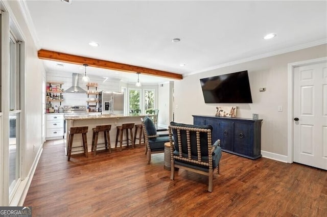 living room featuring dark wood-type flooring, beamed ceiling, and crown molding