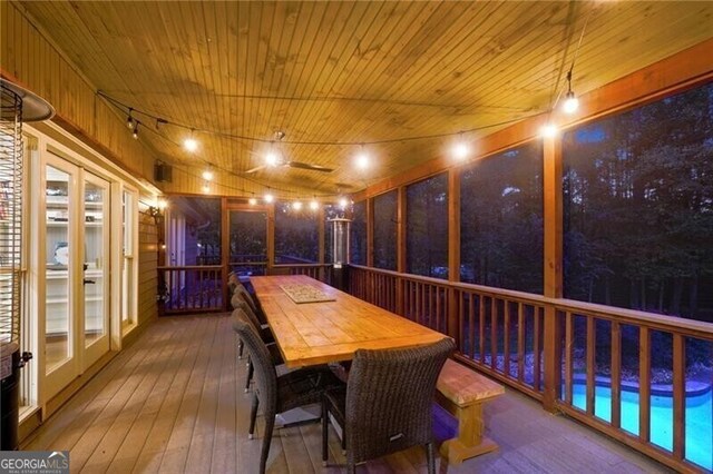 sunroom featuring wooden ceiling and french doors