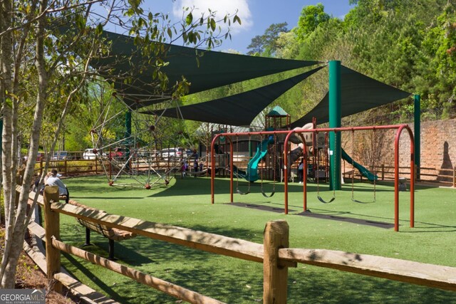 318 Sandy Springs Cir Unit 260, Sandy Springs, GA 30328 - community playground featuring a yard and fence