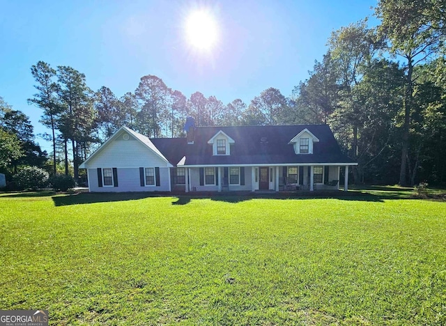 new england style home featuring a front lawn