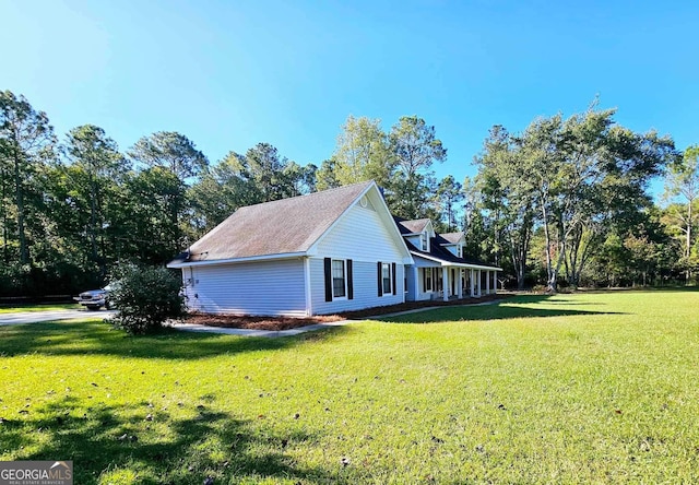 view of side of property featuring a yard