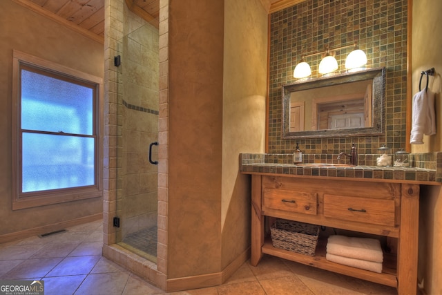 bathroom featuring vanity, ornamental molding, decorative backsplash, and walk in shower