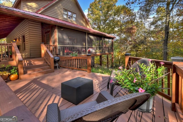 wooden deck featuring a sunroom