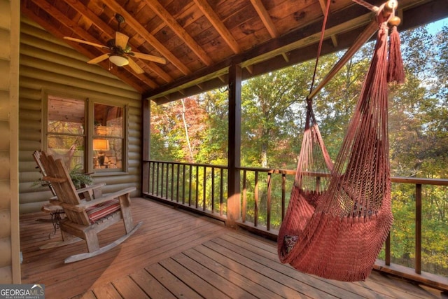 sunroom featuring vaulted ceiling, a wealth of natural light, and ceiling fan