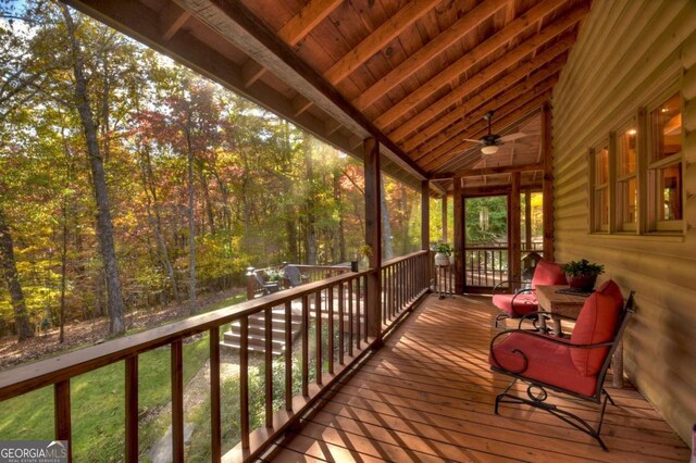 wooden terrace featuring ceiling fan