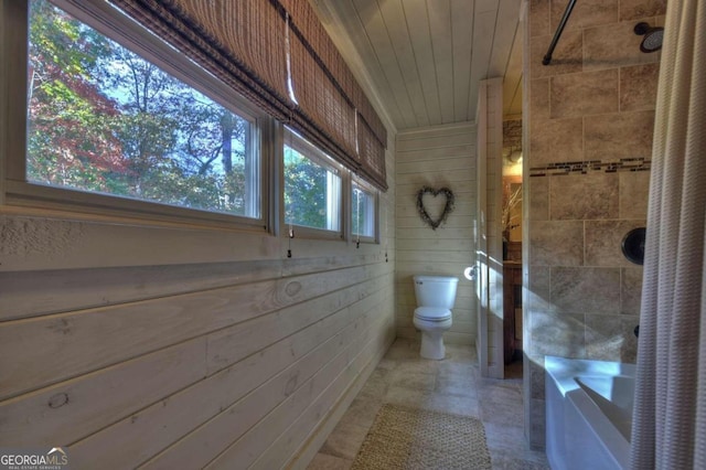 bathroom featuring wood ceiling, toilet, and wooden walls