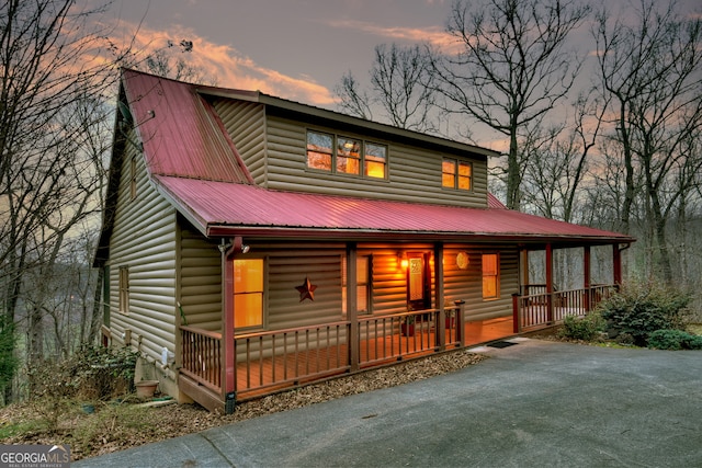 cabin featuring covered porch