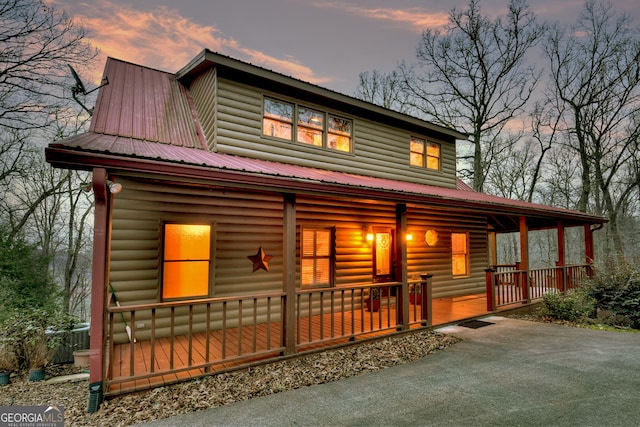 cabin featuring covered porch