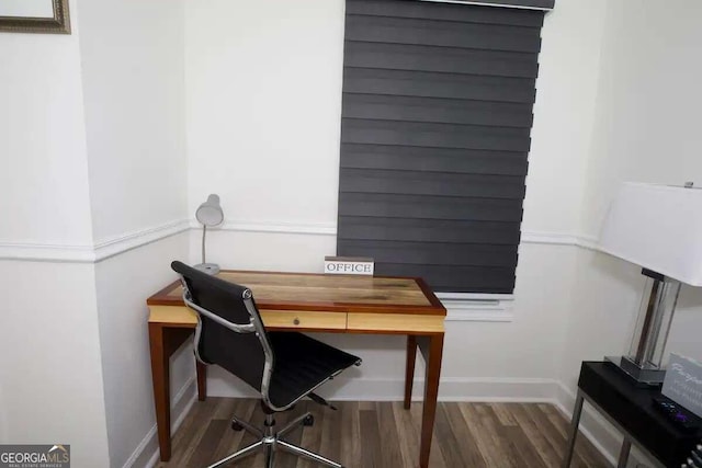 office with dark hardwood / wood-style flooring