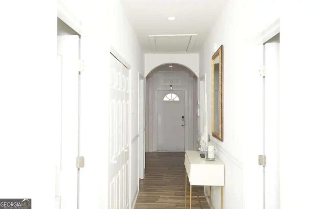 corridor with dark hardwood / wood-style floors