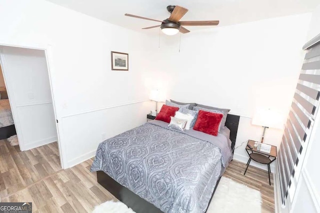 bedroom featuring ceiling fan and light hardwood / wood-style floors