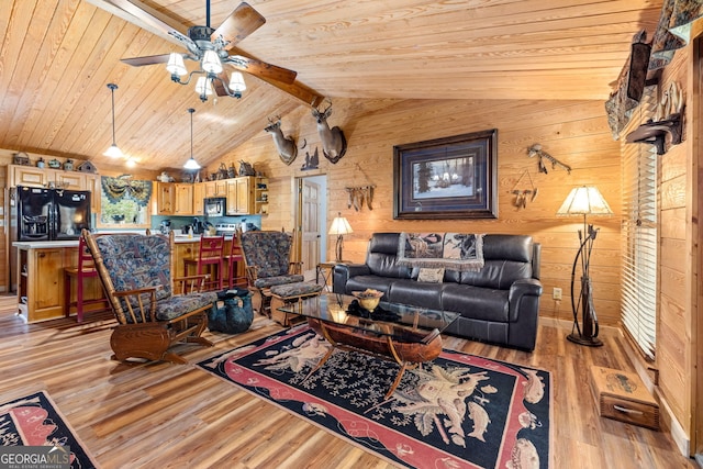 living room featuring wooden ceiling, light hardwood / wood-style floors, wooden walls, ceiling fan, and beam ceiling