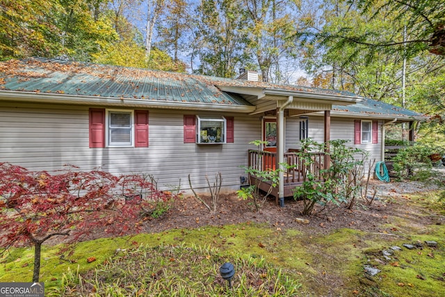 view of front of property featuring a wooden deck