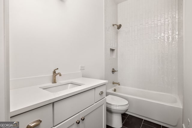 full bathroom with tile patterned flooring, vanity, toilet, and tiled shower / bath