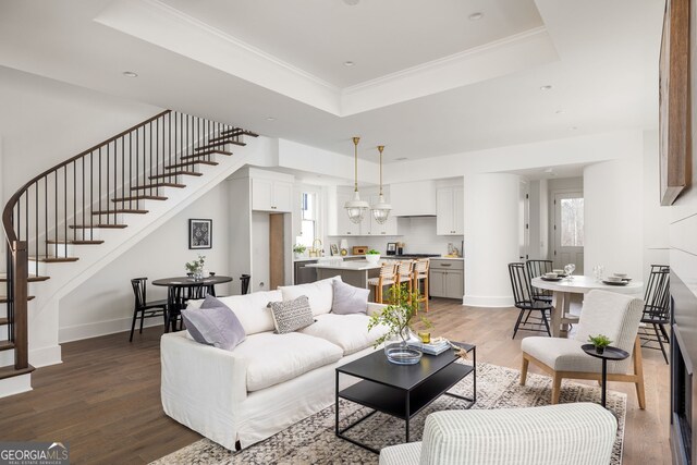 kitchen featuring a kitchen island, decorative light fixtures, dark hardwood / wood-style flooring, appliances with stainless steel finishes, and decorative backsplash